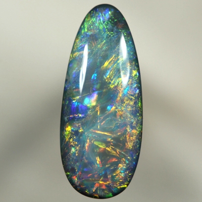 SOLID BLACK OPAL 3480 Beautiful bright burning orange together with green and blue. Top quality, always moving fire. SEE VIDEO
